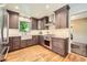Stylish kitchen featuring granite countertops, stainless steel appliances, and hardwood floors at 1600 Olive St, Denver, CO 80220