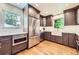 Renovated kitchen with stainless steel appliances, granite countertops, and hardwood floors at 1600 Olive St, Denver, CO 80220