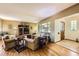 Cozy living room featuring hardwood floors, ample natural light, and comfortable seating at 1600 Olive St, Denver, CO 80220
