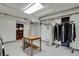 Well-lit utility room with storage, utility access and laundry capabilities at 1600 Olive St, Denver, CO 80220