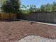 Spacious backyard, freshly mulched and bordered with gravel, enclosed by wooden fences, providing a serene outdoor setting at 2510 Kenton, Aurora, CO 80010