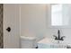 Stylish bathroom featuring sleek fixtures, a modern vanity, and geometric tile in the shower at 2510 Kenton, Aurora, CO 80010