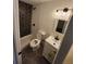 Contemporary bathroom showcasing a shower with hexagon tile, updated lighting, and modern fixtures at 2510 Kenton, Aurora, CO 80010