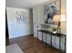 Welcoming entryway with hardwood floors, modern decor, and a stylish console table with an art at 2510 Kenton, Aurora, CO 80010