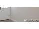 Bright hallway with a freshly painted wall and a newly installed white door perfect for a modern home at 2510 Kenton, Aurora, CO 80010
