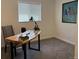 Bright office space featuring a live edge desk, modern lamp, and a sun-filled window for a productive work environment at 2510 Kenton, Aurora, CO 80010