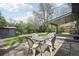 Backyard patio with a dining set, shed, and lush green lawn at 3179 S University Blvd, Englewood, CO 80113