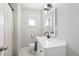 Clean bathroom with white vanity, modern fixtures, and natural light at 3179 S University Blvd, Englewood, CO 80113