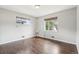 Cozy bedroom with hardwood floors and two windows providing natural light at 3179 S University Blvd, Englewood, CO 80113