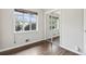 Bedroom featuring hardwood floors and a closet with sliding mirror doors at 3179 S University Blvd, Englewood, CO 80113
