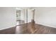 Bedroom featuring hardwood floors, mirrored closet and two entry doors at 3179 S University Blvd, Englewood, CO 80113