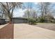 Exterior shot of a well-kept home with a spacious driveway leading to a convenient two-car garage at 3179 S University Blvd, Englewood, CO 80113