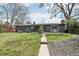 Charming single-story home with a well-maintained front yard at 3179 S University Blvd, Englewood, CO 80113