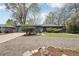 Charming ranch-style home featuring a well-maintained yard and mature trees, creating a welcoming curb appeal at 3179 S University Blvd, Englewood, CO 80113