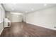 Open living space with hardwood floors, neutral paint, and recessed lighting providing a blank canvas for design at 3179 S University Blvd, Englewood, CO 80113