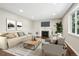 Comfortable living room offering a fireplace, stylish seating, and abundant natural light at 3179 S University Blvd, Englewood, CO 80113