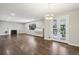 Open concept living room with hardwood flooring, fireplace, and natural light, offering a versatile living space at 3179 S University Blvd, Englewood, CO 80113