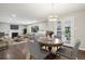 Bright and inviting living room featuring hardwood floors, a fireplace, and elegant French doors to outdoor space at 3179 S University Blvd, Englewood, CO 80113