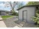 Backyard shed adjacent to a patio with dining set at 3179 S University Blvd, Englewood, CO 80113
