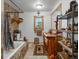 Rustic bathroom featuring a unique, wood countertop vanity and warm, earthy-toned tile work at 16535 W 79Th Dr, Arvada, CO 80007