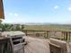 Relaxing deck with a hot tub and comfortable seating, offering stunning views at 16535 W 79Th Dr, Arvada, CO 80007