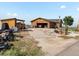 Exterior of a charming home with a brick garage and a well-maintained yard at 16535 W 79Th Dr, Arvada, CO 80007