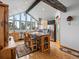 Bright kitchen features wood cabinetry, butcher block island, stainless appliances, wood floors, and vaulted ceilings at 16535 W 79Th Dr, Arvada, CO 80007