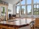 Bright kitchen with butcher block countertops, stainless appliances, farmhouse sink, and large windows at 16535 W 79Th Dr, Arvada, CO 80007