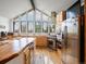 Bright kitchen with stainless steel appliances, wooden cabinets, butcher block counters and large windows at 16535 W 79Th Dr, Arvada, CO 80007