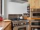 A chef-style stainless steel oven and wood cabinets are featured in the kitchen at 16535 W 79Th Dr, Arvada, CO 80007