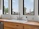 Kitchen sink with butcher block countertops and a window overlooking the backyard at 16535 W 79Th Dr, Arvada, CO 80007