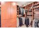 Spacious walk-in closet with wood built-in shelves and hanging racks at 1900 E Girard Pl # 908, Englewood, CO 80113
