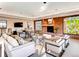 Cozy community room featuring a brick fireplace, ample seating, and natural light for comfortable socializing and relaxation at 1900 E Girard Pl # 908, Englewood, CO 80113