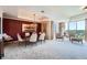 Elegant dining room with chandelier, large painting, and scenic views at 1900 E Girard Pl # 908, Englewood, CO 80113