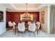 Formal dining room featuring traditional decor, chandelier, and ample seating at 1900 E Girard Pl # 908, Englewood, CO 80113