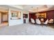 Dining area adjacent to a modern bar and living space with scenic views at 1900 E Girard Pl # 908, Englewood, CO 80113