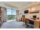 Comfortable living room with a great view from a large window and office space at 1900 E Girard Pl # 908, Englewood, CO 80113