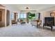 Open living space with large windows, fireplace, and comfortable seating at 1900 E Girard Pl # 908, Englewood, CO 80113