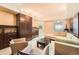 Spacious living room featuring custom built-in cabinets, comfortable seating, and elegant decor for entertaining guests at 1900 E Girard Pl # 908, Englewood, CO 80113