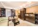 Bright living room with custom shelving, comfortable seating, and natural light, ideal for relaxation and entertaining at 1900 E Girard Pl # 908, Englewood, CO 80113