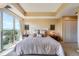 Bright main bedroom with a spacious layout, decorative wall art and large window at 1900 E Girard Pl # 908, Englewood, CO 80113