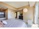 Comfortable main bedroom with bedside tables and a large window view at 1900 E Girard Pl # 908, Englewood, CO 80113