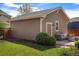 A well-kept backyard featuring a patio with a fire pit and a detached garage at 3476 Beeler Ct, Denver, CO 80238