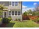 A landscaped backyard with a manicured lawn and a well-maintained wooden fence at 3476 Beeler Ct, Denver, CO 80238