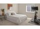 Cozy bedroom featuring a comfortable bed, window, and exercise equipment at 3476 Beeler Ct, Denver, CO 80238