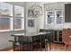 Bright dining area with pendant lighting, hardwood floors, and white countertops at 3476 Beeler Ct, Denver, CO 80238