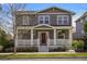 Charming two-story home featuring a welcoming front porch and well-maintained landscaping at 3476 Beeler Ct, Denver, CO 80238