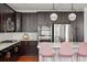 Modern kitchen boasting dark cabinets, quartz countertops, and stainless steel appliances at 3476 Beeler Ct, Denver, CO 80238