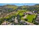 Aerial view of a neighborhood featuring green spaces and a school in the background at 469 Tripp Dr, Golden, CO 80401