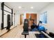 Bright basement gym featuring a full set of exercise equipment and light wood flooring at 469 Tripp Dr, Golden, CO 80401